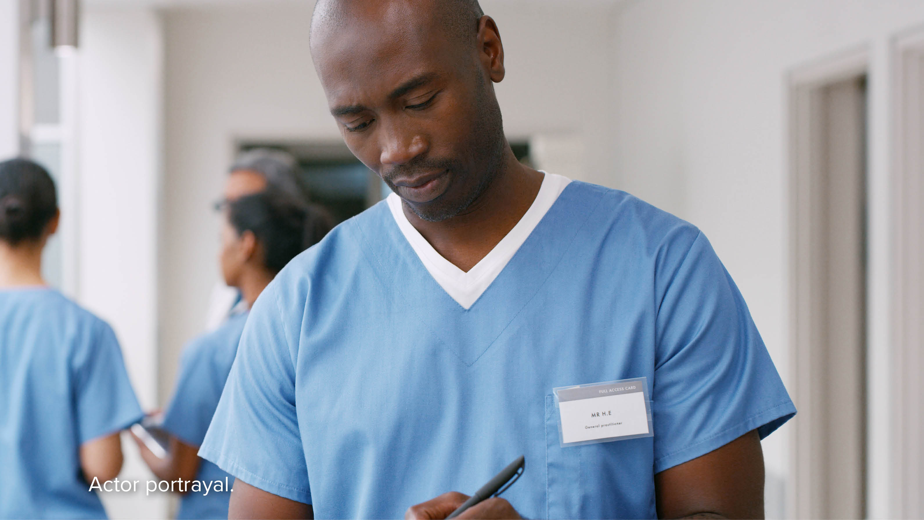 Male nurse writing